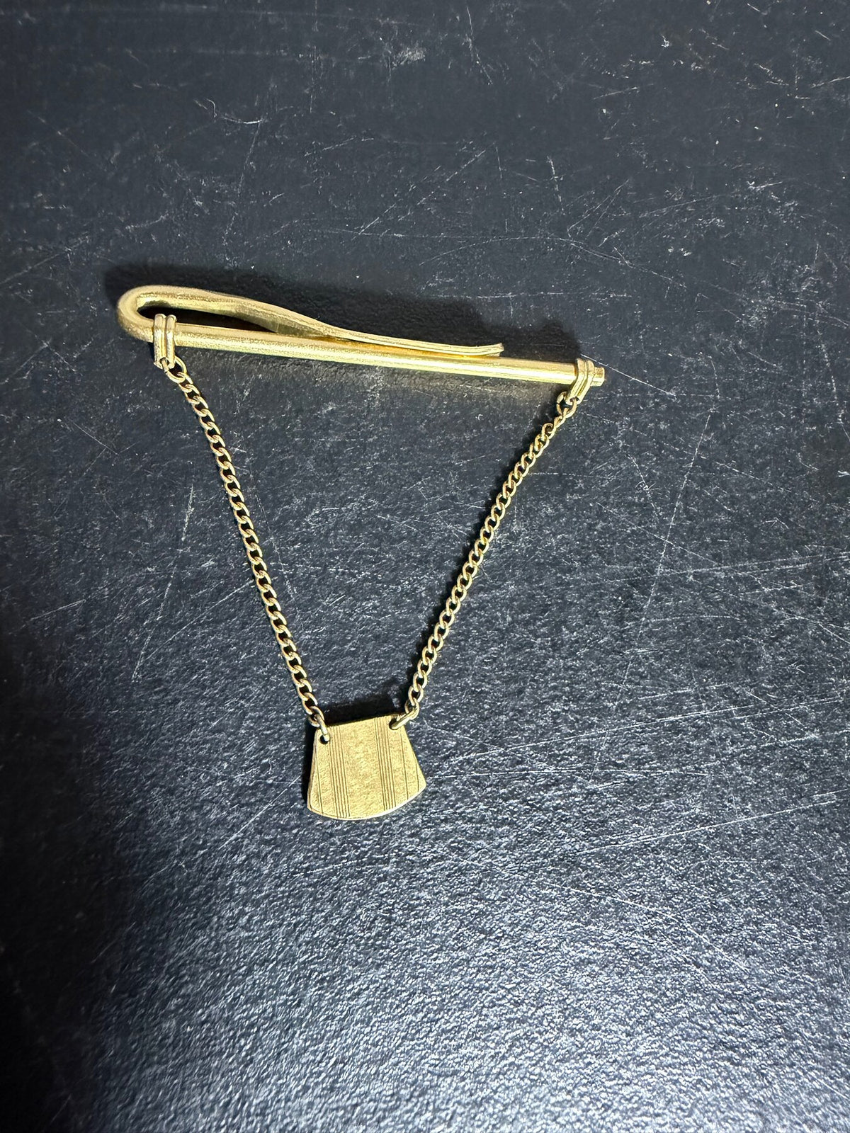 Vintage Swank Gold Tone Tie Bar Clip with Chain and Shield Charm photo 1