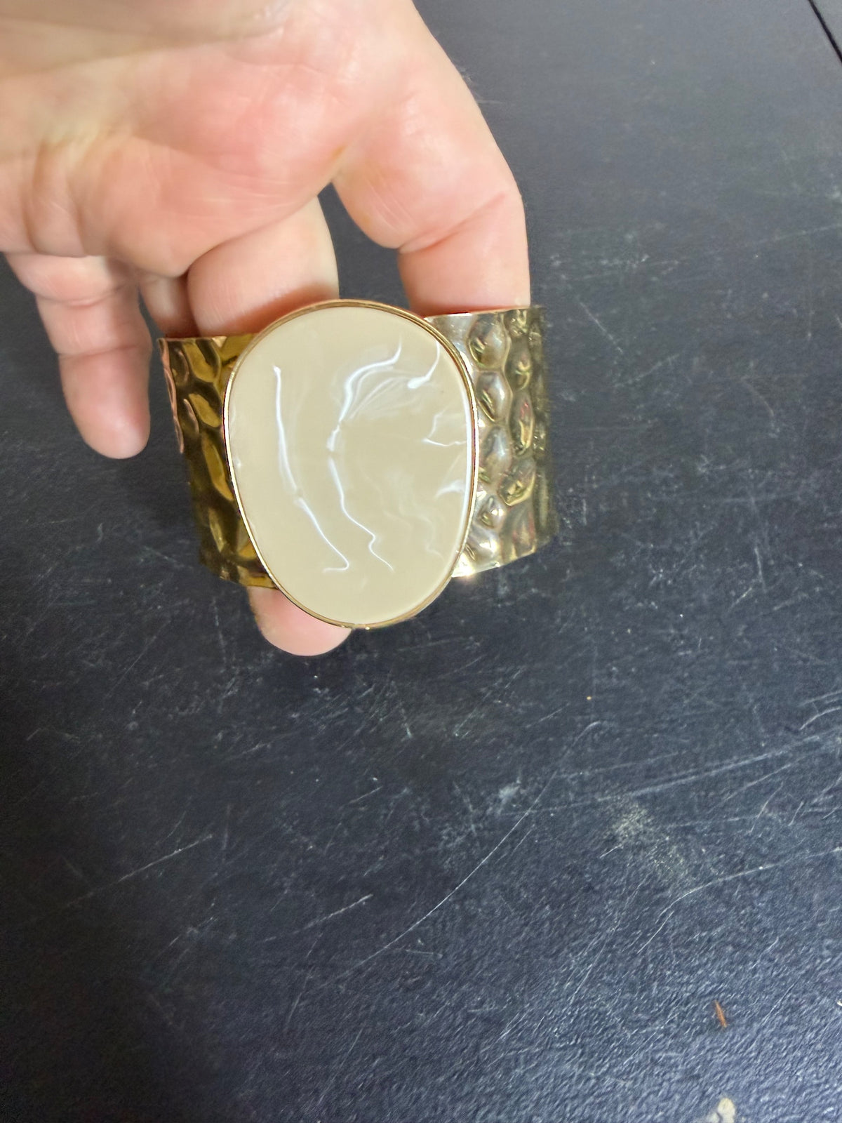 Gold Tone Hammered Cuff Bracelet with Swirled Beige Inlay - Wormhole Thrift